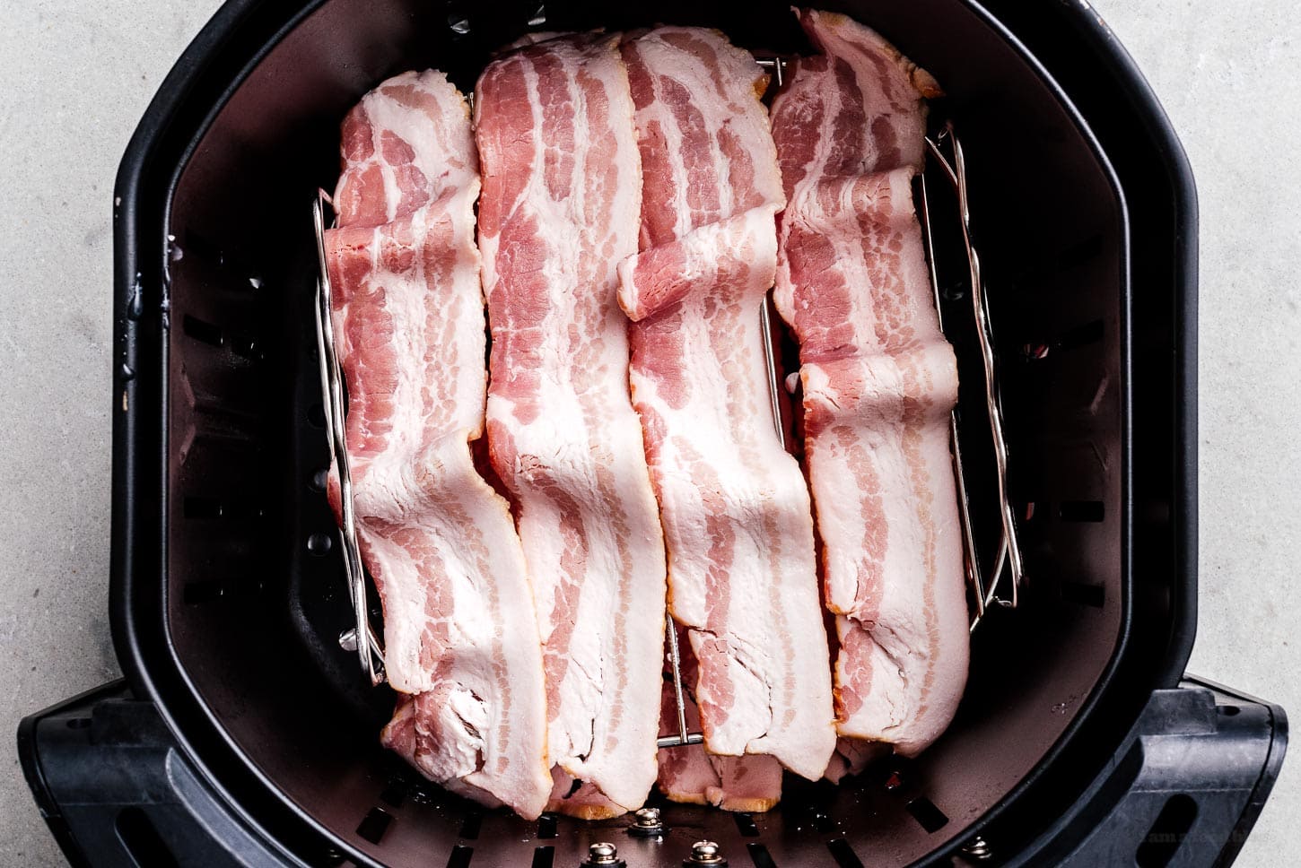 bacon on air fryer racks | www.iamafoodblog.com