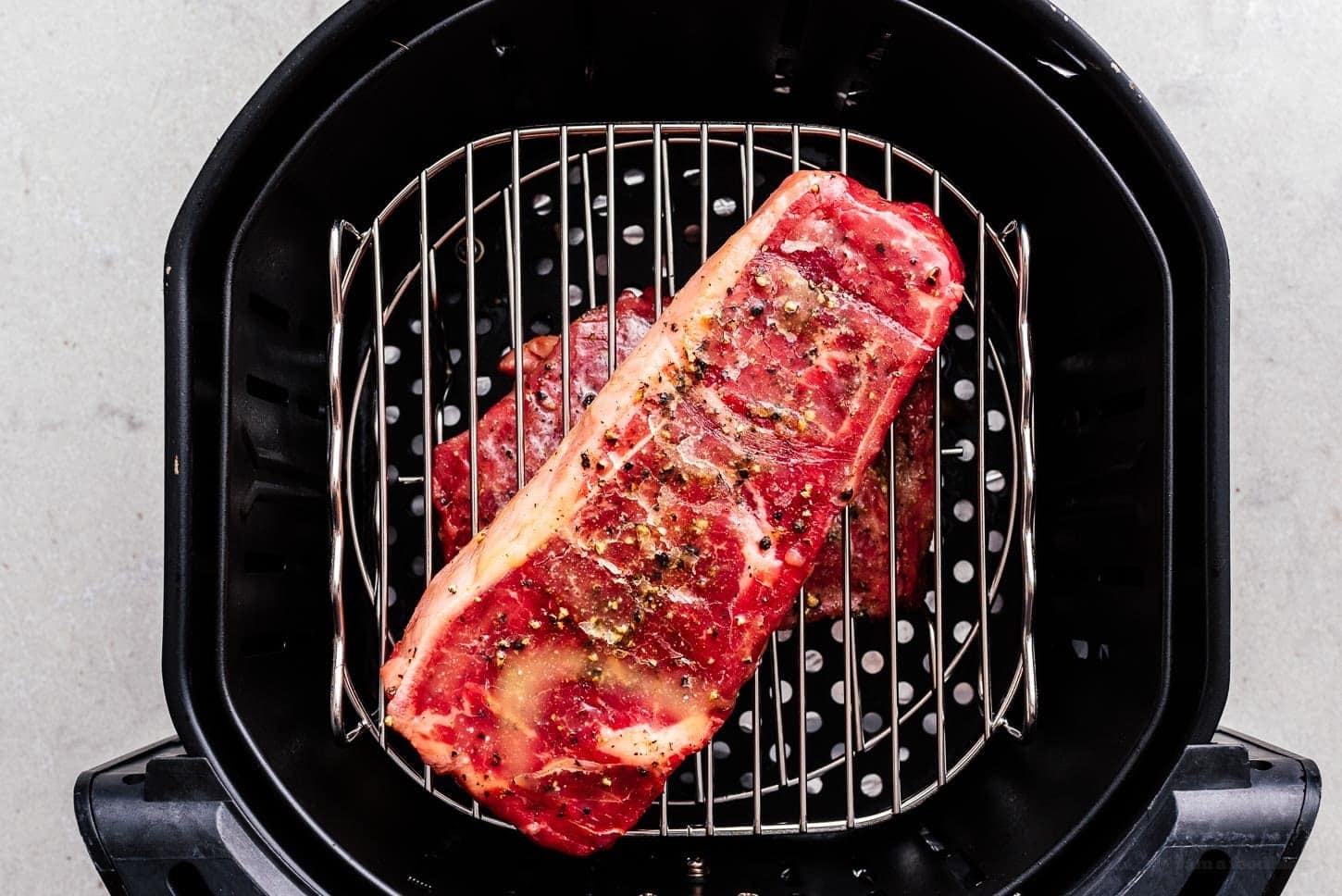 steaks in air fryer basket | www.iamafoodblog.com