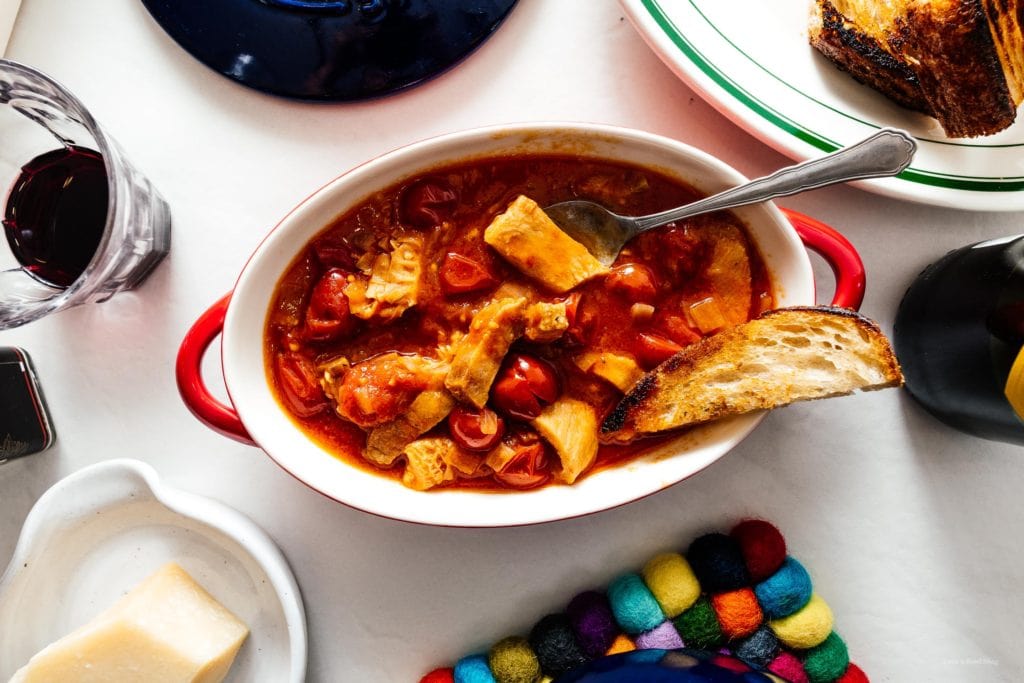 Trippa alla Romana or Roman style tripe in tomato sauce: super tender and rich honeycomb tripe slow cooked in a savory Roman style tomato sauce. #tripe #italianfood #romanfood #recipe