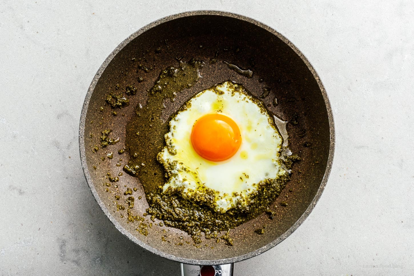frying egg in pesto | www.iamafoodblog.com