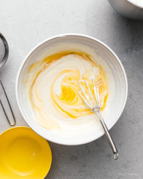 A super cute fluffy, jiggly Totoro cheesecake: pillowy soft, cotton-y, light-as-air cheesecake with just a hint of sweetness. #cheesecake #japanesecheesecake #fluffycheesecake #totorocake #totorocheesecake #totorofood #kawaiifood